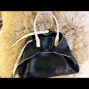 Akris black leather crossbody bag white handles.